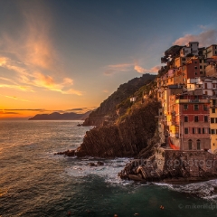 Riomaggiore Sunset Rolling Waves Beautiful sunset light and gentle waves create a memorable scene in Riomaggiore
