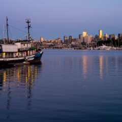 Seattle Skyline and Tug at Sunset Seattle's Gasworks Park began as, surprise, a Gas Works. Decommissioned years ago, its now one of the city's most popular parks for views of Lake Union and the...