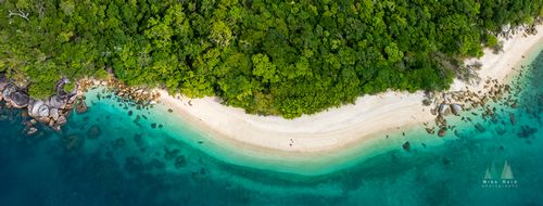 Aerial View of Nudey Beach, Fitzroy Island – Turquoise Waters off Cairns, Australia A mesmerizing aerial photograph of Nudey Beach on Fitzroy Island, just off the coast of Cairns in Far North Queensland. The image captures the island’s lush...