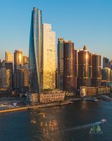 Aerial View of Crown Sydney and Barangaroo at Sunset – Sydney Harbour Skyline An aerial photograph capturing the sleek silhouette of Crown Sydney rising above Barangaroo as the warm sunset light glows across Sydney Harbour. The golden...