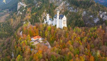 Aerial Castle Neuschwanstein Fall Colors 2 Experience the breathtaking beauty of Castle Neuschwanstein in southern Germany as autumn transforms Bavaria’s landscape into a mosaic of gold, orange, and...