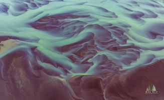 Braided River Delta, Iceland – Aerial Abstract in Blue and Violet This captivating aerial photograph showcases the surreal patterns of Iceland’s braided river delta, where glacial meltwater flows through volcanic terrain in...