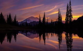 Tipsoo Searing Skies Amazing sunset colors and dusk glow on the Mountain reflect in Tipsoo Lake.