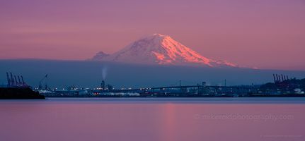 Mount Rainier Sunset Over Elliott Bay – Long Exposure at 200mm A breathtaking long-exposure view of Mount Rainier glowing at sunset above the Elliott Bay waterfront, captured with a Canon 200mm f/1.8 lens. The fading light...