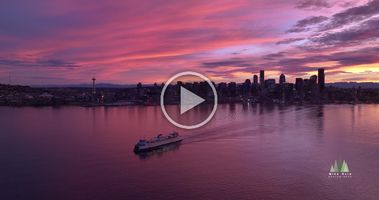 Aerial Seattle Ferry to Bainbridge at Sunrise 5K A stunning 5K aerial video capturing a Washington State Ferry departing Seattle for Bainbridge Island under the warm glow of sunrise. The soft morning light...