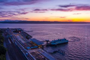 Northwest Aerial Photography Over Mukilteo Ferry.jpg Aerial view of the new Mukilteo ferry terminal at sunset, where warm evening light reflects across Puget Sound and the terminal’s modern architecture glows...