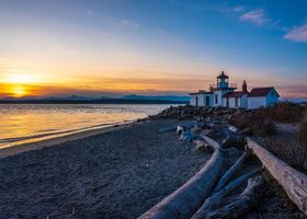 Seattle Photography Discovery Park Lighthouse The golden glow of sunset washes over Discovery Park Lighthouse, one of Seattle’s most peaceful coastal landmarks. Driftwood lines the quiet beach as soft waves...