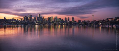 Seattle Lake Union Cityscape Dawn Reflection Sunrise view of the Seattle skyline from Gas Works Park, with the Space Needle and downtown reflected in the calm waters of Lake Union under a pink and purple...