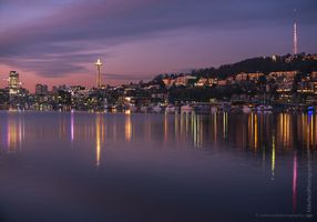 Seattle Lake Union Dawn Reflection at Christmas Seattle’s Space Needle and Queen Anne Hill reflected on Lake Union at twilight during the Christmas season, with festive lights glowing along the waterfront and...