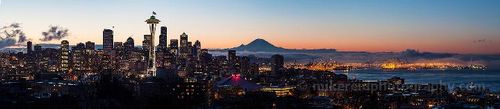 Beautiful Seattle City Sunrise Puget Sound A panoramic sunrise view of Seattle from Kerry Park, featuring the Space Needle proudly flying the Seahawks 12 flag above the glowing downtown skyline. Mount...