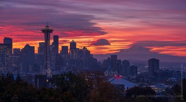 Seattle Photography Kerry Park Fiery Sunrise Skies Fuji GFX50s A breathtaking Seattle sunrise captured from iconic Kerry Park, showcasing the Space Needle, downtown skyline, and distant Mount Rainier bathed in vivid hues of...