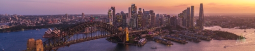 Downtown Sydney Skyline Harbor Bridge and Opera House at Sunset Aerial Panorama.jpg default