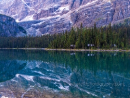 Lake O’Hara Lodge Cabins and Mount Schaffer Reflections | Yoho National Park Fine Art Print Nestled beneath the towering cliffs of Mount Schaffer, the cozy cabins of Lake O’Hara Lodge rest quietly along the water’s edge. Captured in Yoho National Park,...