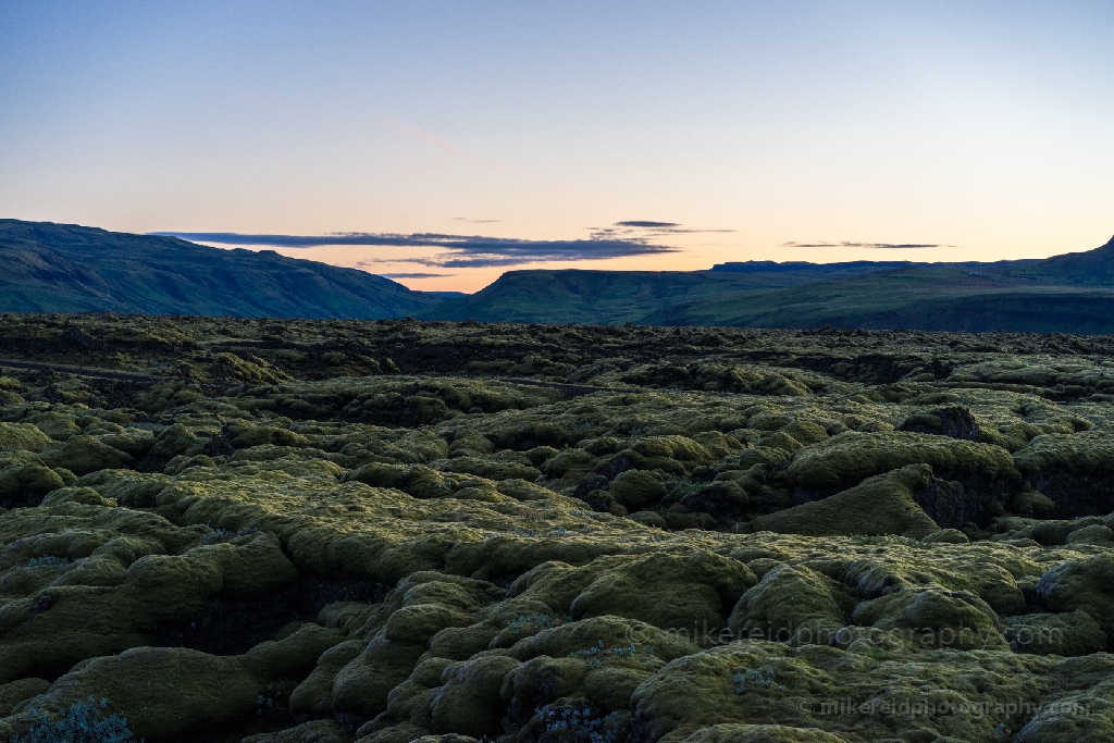 Iceland Ring Road Lavascape – Moss-Covered Lava Fields at Dusk | Fine Art Landscape Soft evening light falls across Iceland’s moss-covered lava fields along the Ring Road, revealing a surreal volcanic landscape shaped by time and nature. This fine art photograph by Mike Reid Photography captures the quiet mystery and texture of Iceland’s lavascape under the fading glow of twilight — a timeless view of the island’s volcanic heart.