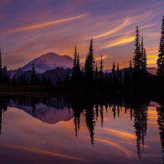 Tipsoo Searing Skies Amazing sunset colors and dusk glow on the Mountain reflect in Tipsoo Lake.