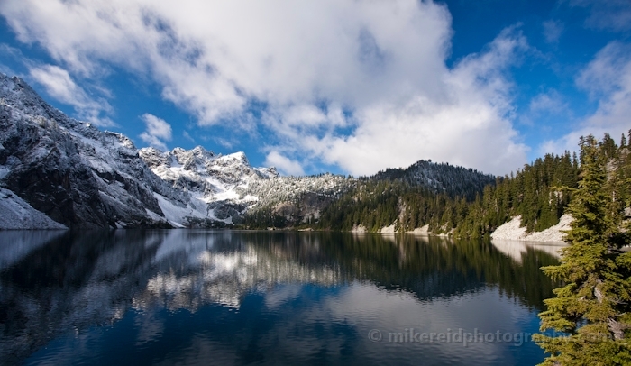 Skies and Mountains Reflected in Snow LAke