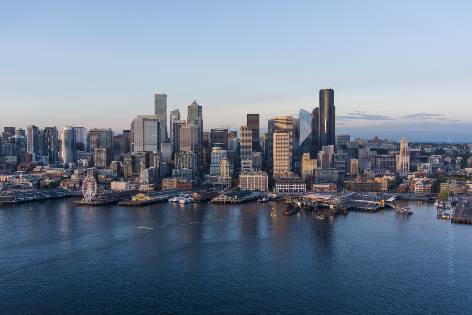 Over Seattle Downtown Dusk Aerial views over Seattle and surroundings in these unique video and photographic perspectives. To arrange a custom Seattle aerial photography tour, please contacct me. #seattle #dronephotography #dronevideo #aerial #aerialphotography #aerialvideo #northwest #washingtonstate