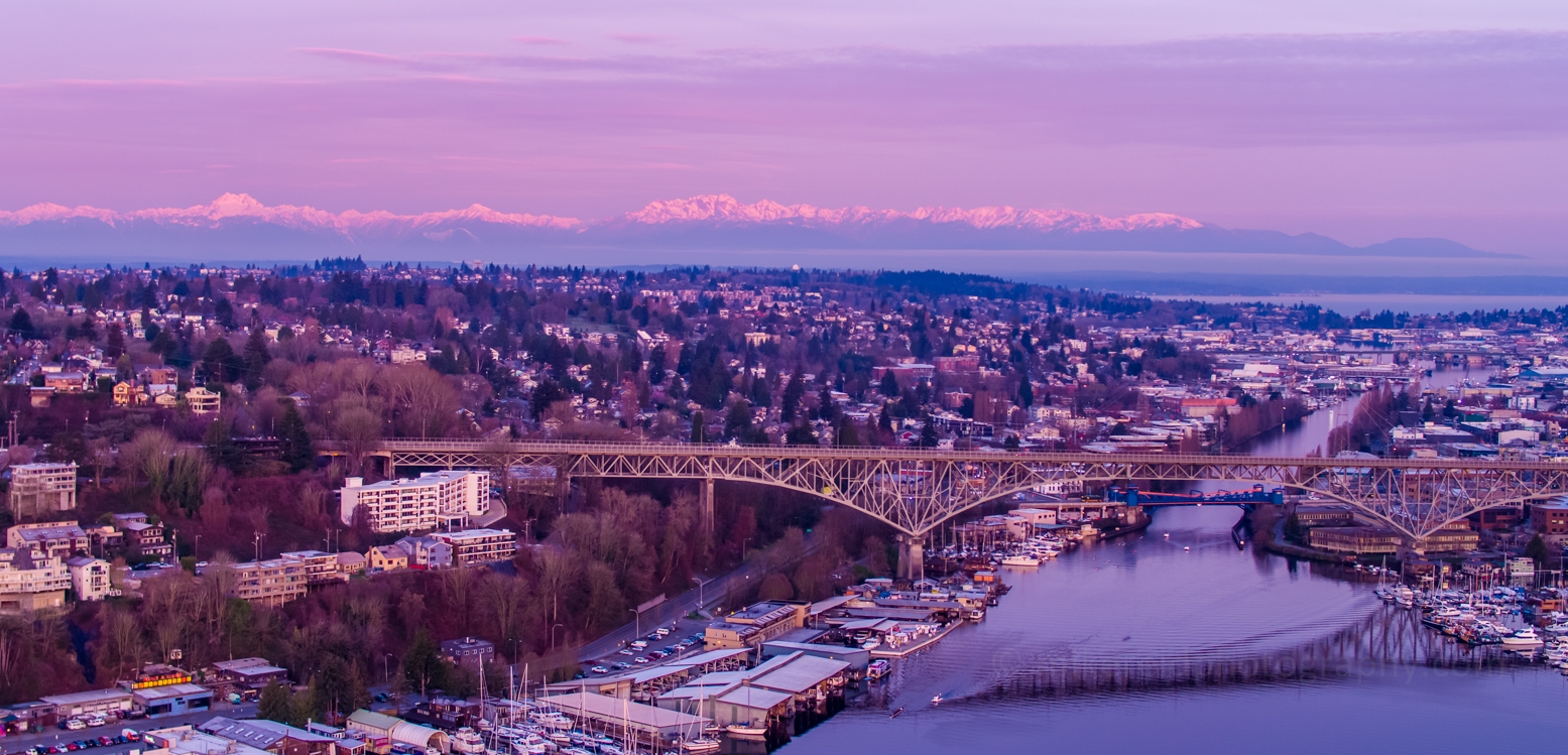Seattle Aerial Photography Aurora Bridge Olympic Mountains Sunrise. #seattle #dronephotography #dronevideo #aerial #aerialphotography #aerialvideo #northwest #washingtonstate