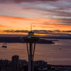 Aerial Seattle Space Needle Sunset Light.jpg To order a print please email me at  Mike Reid Photography : seattle, sky view observatory, svo, zeiss lenses, columbia center, urban, sunrise, fog, sunset, puget sound, elliott bay, space needle, northwest, washington, rainier, aerial, a7r, seattle aerial photography, northwest aerial photography, university of washington, alki, seattle photography