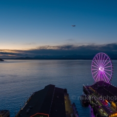 Over Seattle Blue Hour Ferry and Wheel.jpg To order a print please email me at  Mike Reid Photography : seattle, sky view observatory, svo, zeiss lenses, columbia center, urban, sunrise, fog, sunset, puget sound, elliott bay, space needle, northwest, washington, rainier, aerial, a7r, seattle aerial photography, northwest aerial photography, university of washington, alki, seattle photography