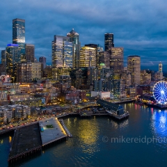 Over Seattle Blue Hour Waterfront Skyline.jpg To order a print please email me at  Mike Reid Photography : seattle, sky view observatory, svo, zeiss lenses, columbia center, urban, sunrise, fog, sunset, puget sound, elliott bay, space needle, northwest, washington, rainier, aerial, a7r, seattle aerial photography, northwest aerial photography, university of washington, alki, seattle photography