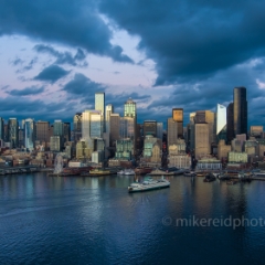 Over Seattle Ferry Arriving at Dusk.jpg To order a print please email me at  Mike Reid Photography : seattle, sky view observatory, svo, zeiss lenses, columbia center, urban, sunrise, fog, sunset, puget sound, elliott bay, space needle, northwest, washington, rainier, aerial, a7r, seattle aerial photography, northwest aerial photography, university of washington, alki, seattle photography