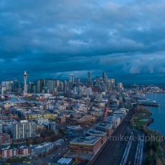 Over Seattle at Dusk Along the Waterfront.jpg To order a print please email me at  Mike Reid Photography : seattle, sky view observatory, svo, zeiss lenses, columbia center, urban, sunrise, fog, sunset, puget sound, elliott bay, space needle, northwest, washington, rainier, aerial, a7r, seattle aerial photography, northwest aerial photography, university of washington, alki, seattle photography