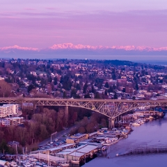 Seattle Aerial Photography Aurora Bridge Olympic Mountains Sunrise.  #seattle #dronephotography #dronevideo #aerial #aerialphotography #aerialvideo #northwest #washingtonstate To order a print please email me at  Mike Reid Photography : seattle, sky view observatory, svo, zeiss lenses, columbia center, urban, sunrise, fog, sunset, puget sound, elliott bay, space needle, northwest, washington, rainier, aerial, a7r, seattle aerial photography, northwest aerial photography, university of washington, alki, seattle photography