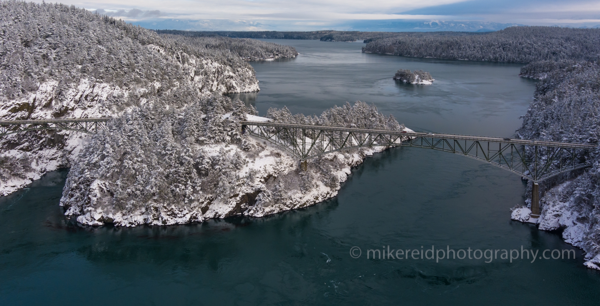 Northwest Aerial Photography Over Deception Pass Bridge Winter Snow.jpg 