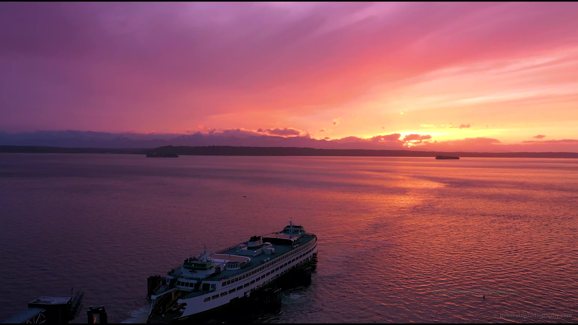 Over Edmonds Ferry Docking at Sunset Drone Video
