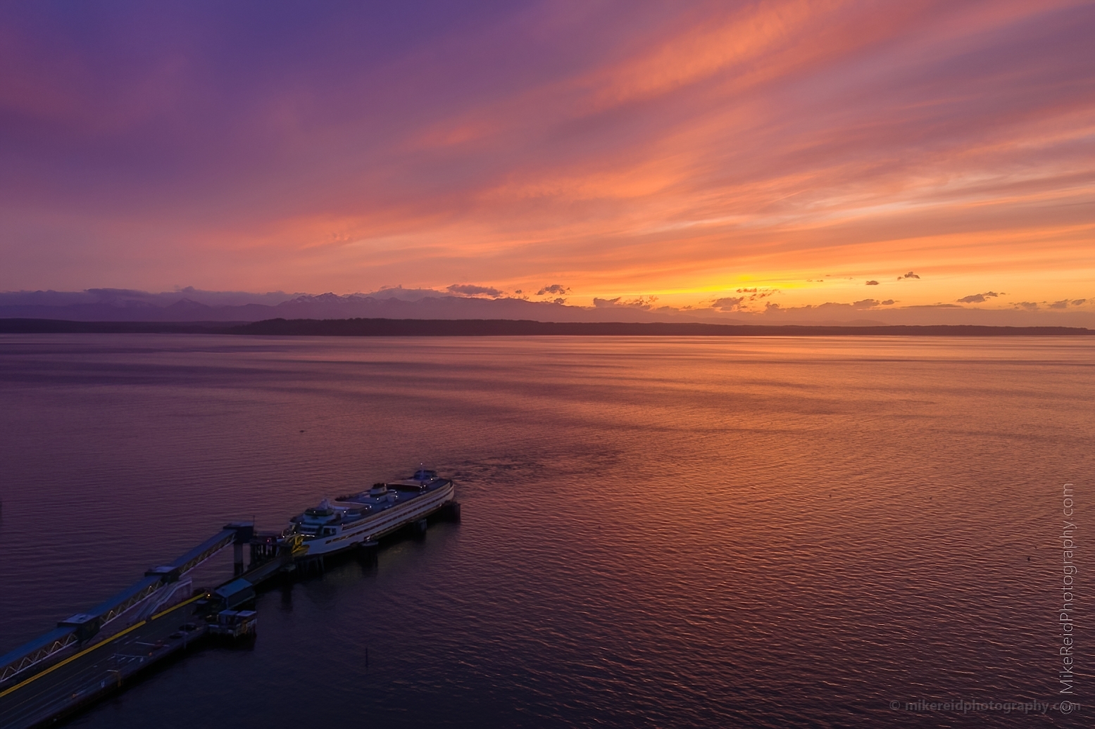 Over Edmonds Ferry Docking at Sunset Fiery Skies Aerial.jpg
