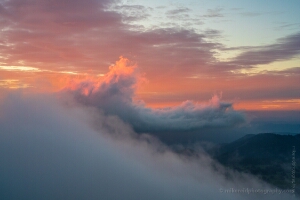 Mount Rainier Fiery Sunset Clouds Wave Cresting.jpg