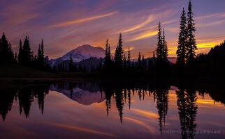 Tipsoo Searing Skies Amazing sunset colors and dusk glow on the Mountain reflect in Tipsoo Lake.