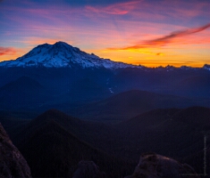 Mount Rainier Photography High Rock Lookout Sunrise Fuji GFX50s The first light of dawn paints Mount Rainier in deep blues and fiery orange hues as seen from High Rock Lookout. Captured with a 50mm lens for natural...