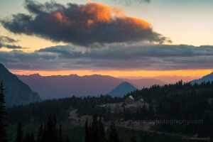 Sunset Over Paradise Visitor Center – Mount Rainier National Park Evening light glows over the Paradise Visitor Center in Mount Rainier National Park, with vibrant layers of alpine ridges fading into the distance beneath...
