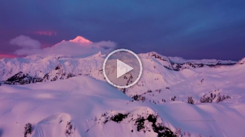 Over Artists Point and Mount Baker Sunrise.mp4 Breathtaking 4K aerial footage of Mount Baker and Artist Point at sunrise, captured in the stillness of winter. Golden light spills across snow-covered ridges...