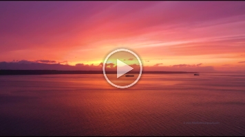 Over Puget Sound Container Ships Sunset on the Salish Sea Drone Video.mp4 Beautiful 4K aerial footage of container ships crossing Puget Sound at sunset, captured over the glowing waters of the Salish Sea. The golden evening light...