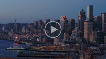 Aerial Downtown Seattle Blue Hour Skyline ProRes422 A breathtaking aerial video of downtown Seattle filmed during the magical blue hour, when the city glows with twilight hues and shimmering reflections across...