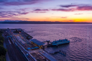 Northwest Aerial Photography Over Mukilteo Ferry.jpg Aerial view of the new Mukilteo ferry terminal at sunset, where warm evening light reflects across Puget Sound and the terminal’s modern architecture glows...