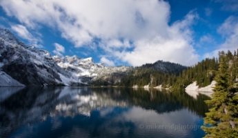 Skies and Mountains Reflected in Snow LAke