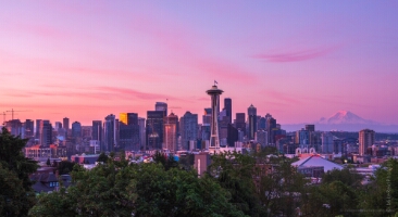 Seattle Kerry Park Dawn Pink City A serene late sunrise view from Kerry Park showcasing Seattle’s skyline bathed in soft pink and lavender light. The Space Needle stands tall against the glowing...