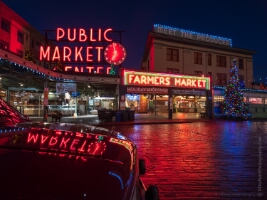 Pike Place Market Christmas Reflection Seattle’s Pike Place Market shines bright on a quiet winter evening, with its iconic red neon “Public Market” sign reflected perfectly in a nearby car hood. The...