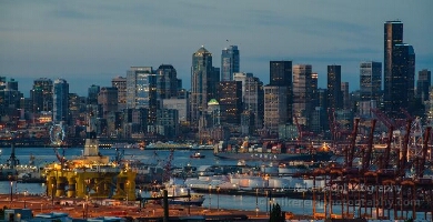 Shell Polar Pioneer Oil Rig in Seattle This dramatic view from atop West Seattle captures the Seattle skyline and busy Port of Seattle illuminated at dusk beneath the towering Cascade Mountains. The...