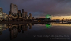 Dark Cityscape Reflected To order a print please email me at  Mike Reid Photography : sunset, sunrise, seattle, northwest photography, dramatic, beautiful, washington, washington state photography, northwest images, seattle skyline, city of seattle, puget sound, aerial san juan islands