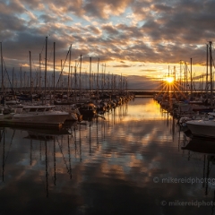 Marina Sunstar To order a print please email me at  Mike Reid Photography : sunset, sunrise, seattle, northwest photography, dramatic, beautiful, washington, washington state photography, northwest images, seattle skyline, city of seattle, puget sound, aerial san juan islands