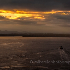 Ferry Heading West To order a print please email me at  Mike Reid Photography : sunset, sunrise, seattle, northwest photography, dramatic, beautiful, washington, washington state photography, northwest images, seattle skyline, city of seattle, puget sound, aerial san juan islands