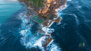 Aerial View of Curl Curl Beach Ocean Pool – Northern Beaches Sydney Coastline A stunning aerial photograph of the Curl Curl Beach ocean pool along Sydney’s Northern Beaches, where turquoise waters meet rugged sandstone cliffs and swirling...