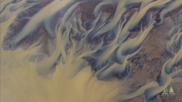 Aerial Abstract of Icelandic River Delta – Glacial Flow Patterns This striking aerial photograph reveals the abstract beauty of Iceland’s glacial river deltas, where meltwater from distant glaciers carves flowing patterns...