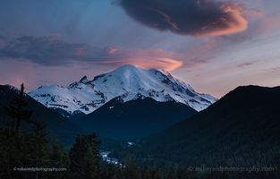 Mount Rainier Lenticular Cloud Sunset Over the White River A breathtaking sunset over Mount Rainier paints the sky with pink and violet tones as lenticular clouds crown the snow-covered summit. Below, the White River...
