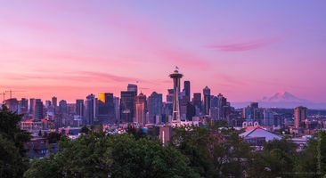 Seattle Kerry Park Dawn Pink City A serene late sunrise view from Kerry Park showcasing Seattle’s skyline bathed in soft pink and lavender light. The Space Needle stands tall against the glowing...